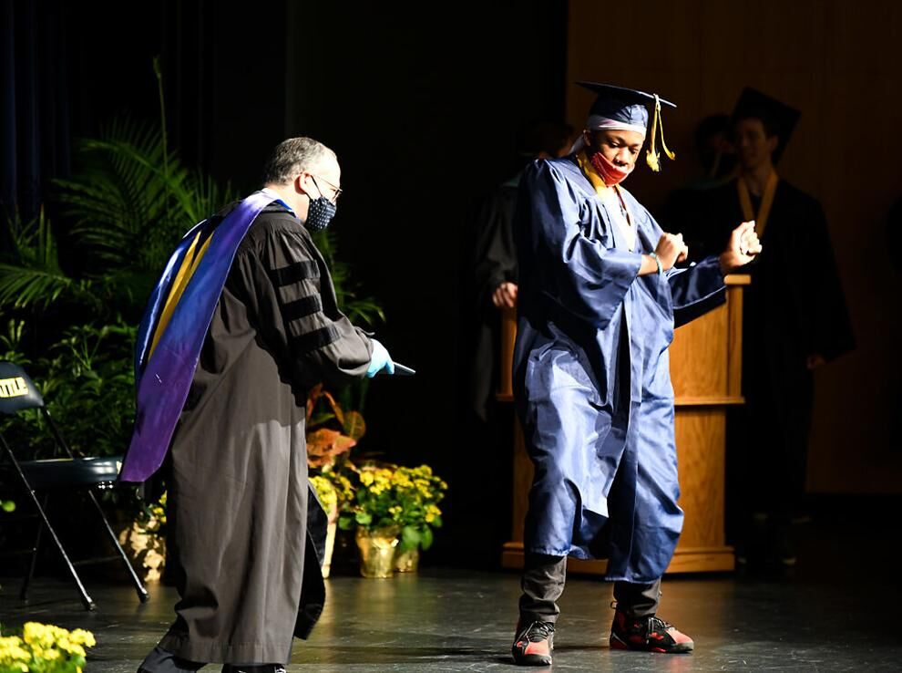 Dennis Darks dances across the stage
